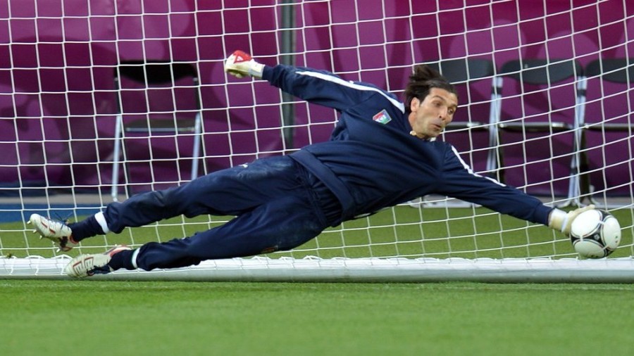 Italian goalkeeper Gianluigi Buffon stretches for the ball during a training session at the Olympic stadium in Kiev on June 23, 2012 on the eve of the quarter-final match England vs Italy during the Euro 2012 football championships..AFP PHOTO/ SERGEI SUPINSKY (Photo credit should read SERGEI SUPINSKY/AFP/GettyImages)